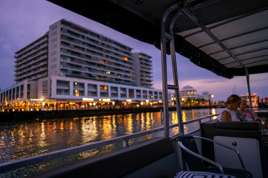 Cairns: Sunset River Cruise with Snack and Drinks - Golden hour, clouds, and Cairns after dark