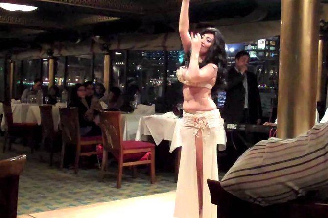 Cairo Dinner Cruise on the River Nile with Belly Dancing Show - Boarding the boat and watching Cairo light up