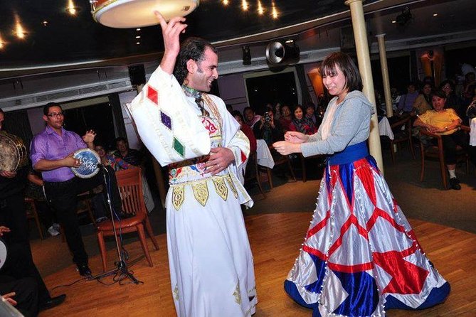 Cairo Dinner Cruise show with belly dancer show on Nile river - Belly dancing, tanoura spinning, and music