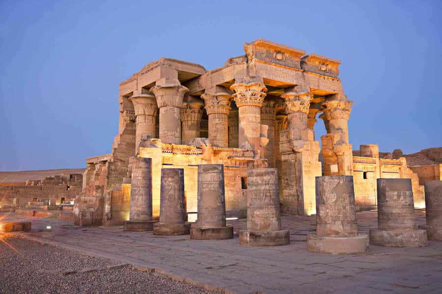 From Aswan: Overnight Nile Cruise to Luxor with Meals - Kom Ombo at sunset, with two gods under one roof