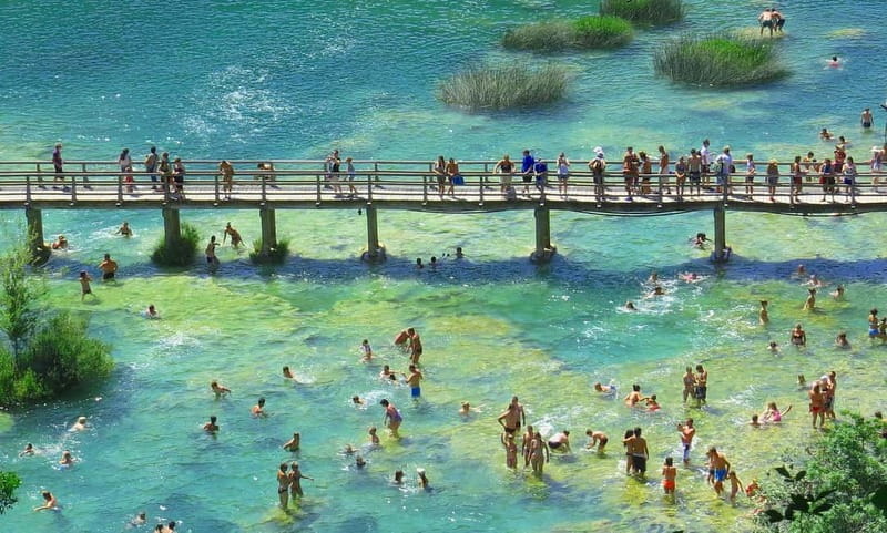 From Split: Krka Waterfalls with Riverboat Ride & swimm stop - Seeing the waterfall, mill, and Etno village