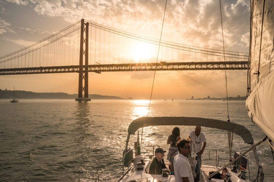 Lisbon: Private Sunset Cruise on the Tagus River with Drink - Under the 25 de Abril Bridge and past Alcântara