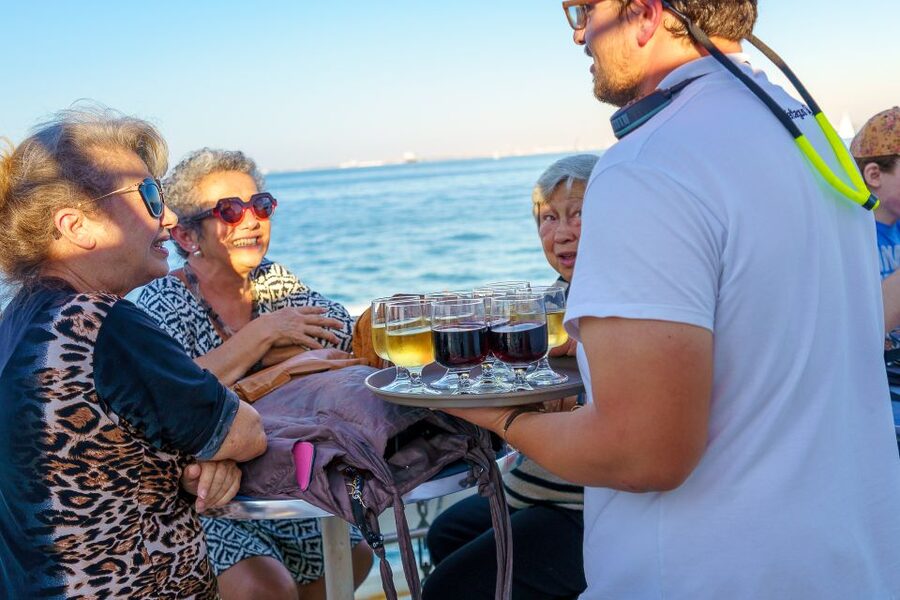 Lisbon: Tagus River Sunset Tour with Snacks and Drink - Under the 25th of April Bridge
