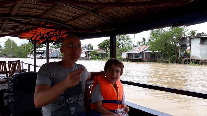Mekong Day Tour by Car:Cai Be market, Local Island & Cycling - A private boat through the Cái Bè waterways