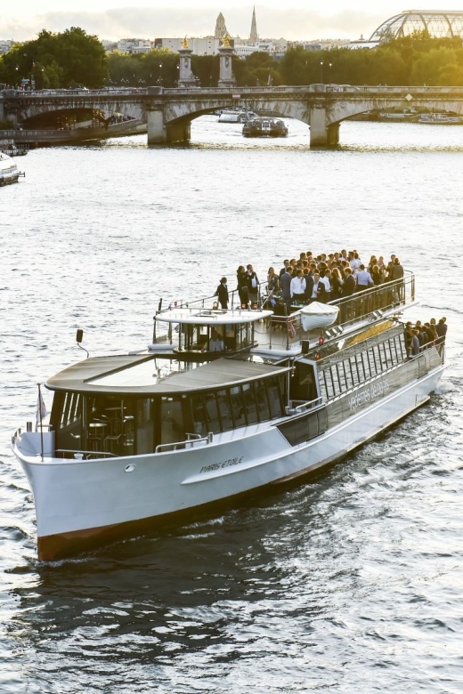 Paris: Evening River Cruise with Music - The Louvre, Concorde, and Parisian grand design