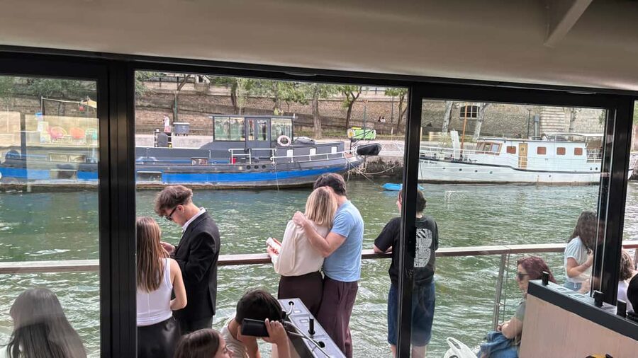 Paris: Illuminations River Cruise with Audio Commentary - Boarding the trimaran at the Eiffel Tower