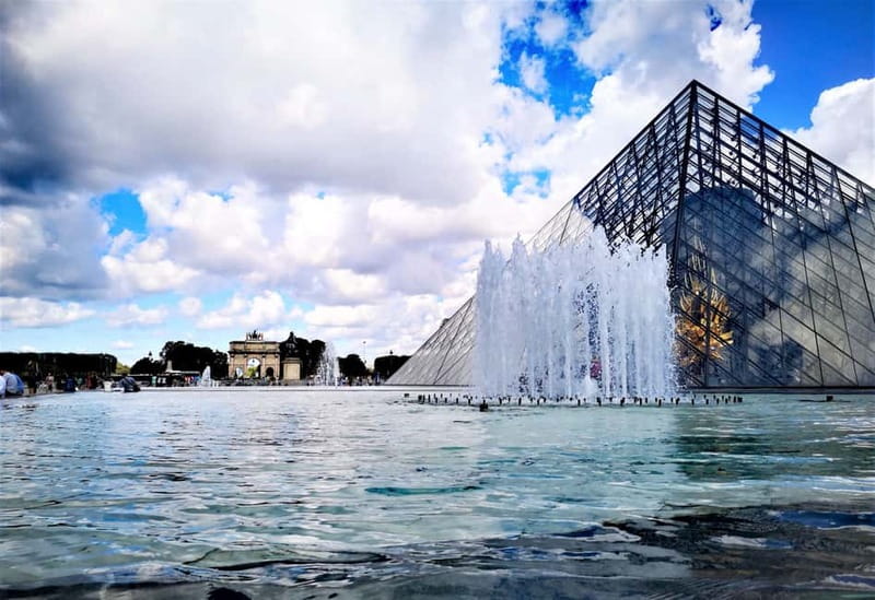 Paris: private city tour with seine river cruise - Saint-Germain-l’Auxerrois and the Louvre courtyards