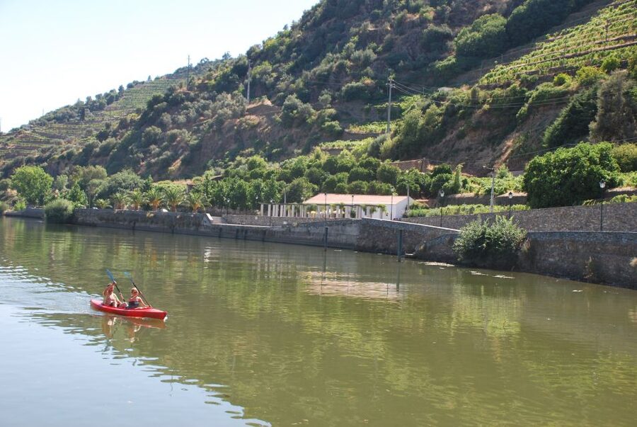 Pinhão: Douro Valley Rabelo Boat Tour and Kayak Experience - Tua marks the change from sightseeing to exercise