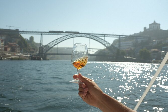Porto: Douro River Boat Cruise with Port Wine and Snacks - Porto’s bridges, from old crossings to modern icons