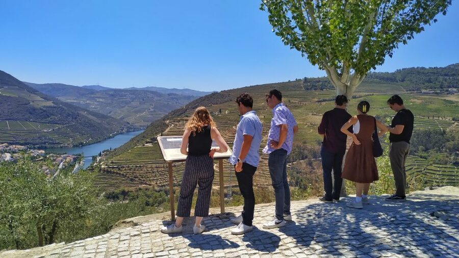 Porto: Douro Valley Wine Tour with Tastings, Boat, and Lunch - A small boat on the Douro near Pinhão