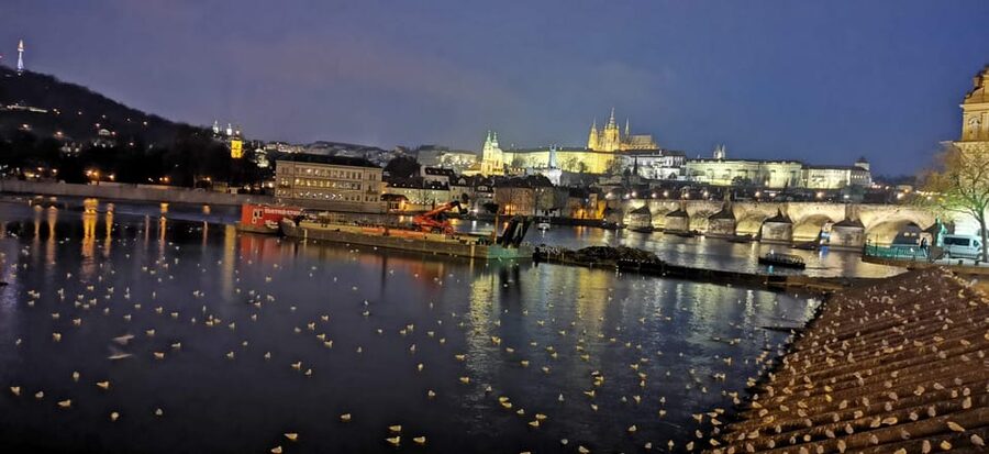 Prague: River Cruise with Transfer to Pier - Prague Castle and Petřín Tower in the distance