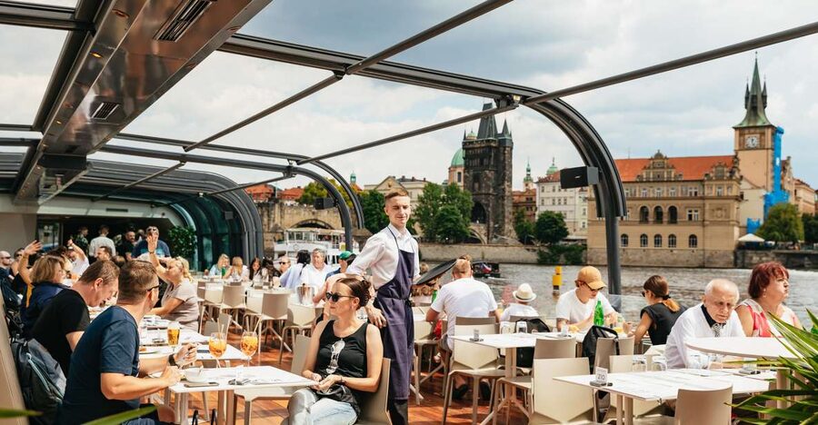 Prague: Vltava River Lunch Cruise in an Open-Top Glass Boat - Live accordion music keeps the mood easy