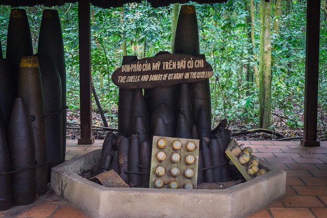 Private Tour to Explore Cu Chi Tunnels and Mekong Delta - Coconut candy, honey tea, fruit, and a wooden sampan