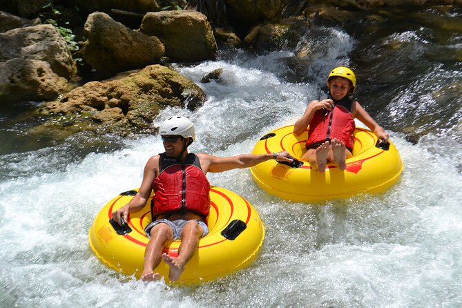 River Rapids Waterfalls Tubing and Beach Adventure with Transport - Bamboo shade, a rope swing, and an old stone bridge