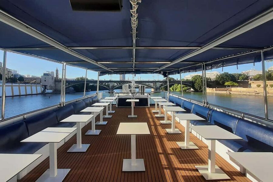 Seville: Restaurant boat ride on the Guadalquivir River with lunch/dinner - A five-course meal with a Sevillian accent