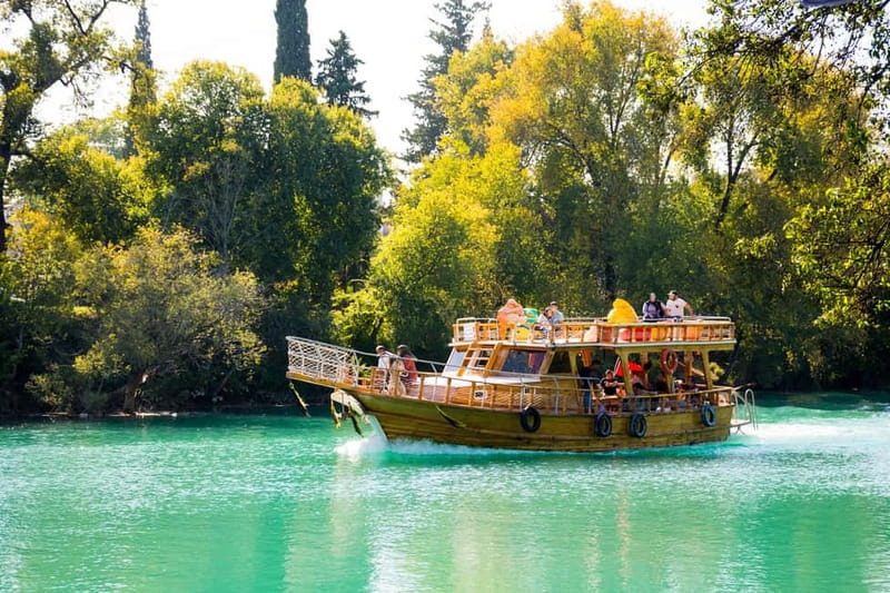 Side: Manavgat River Boat Trip & Grand Market w/ Lunch - Cruising the Manavgat River by wooden boat