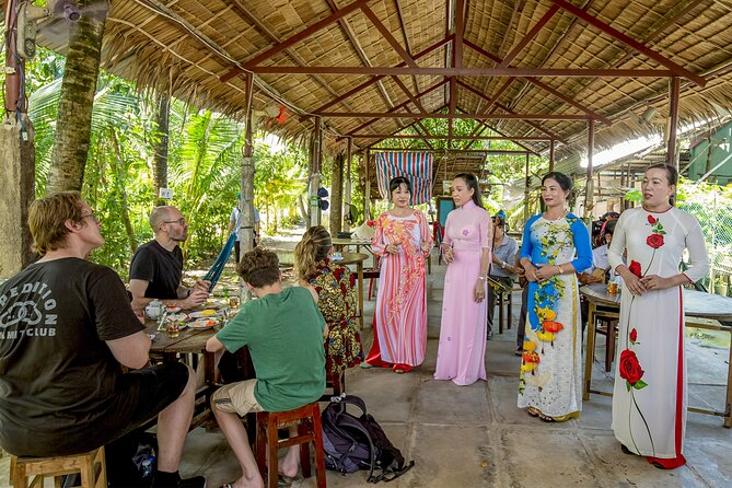Small-Group Mekong Delta Day Trip: Boat Ride, Cottages & Pagoda - Traditional music and the tourist side of the Delta
