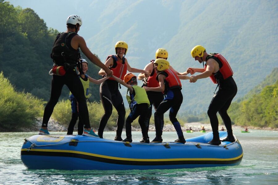 Soča River: Family Rafting Adventure, with Photos - Paddling through easy rapids near Bovec