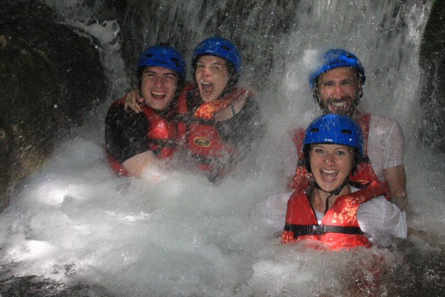 Split: Cetina River Rafting with Cliff Jumping and Cave Tour - Entering the cave behind the waterfall