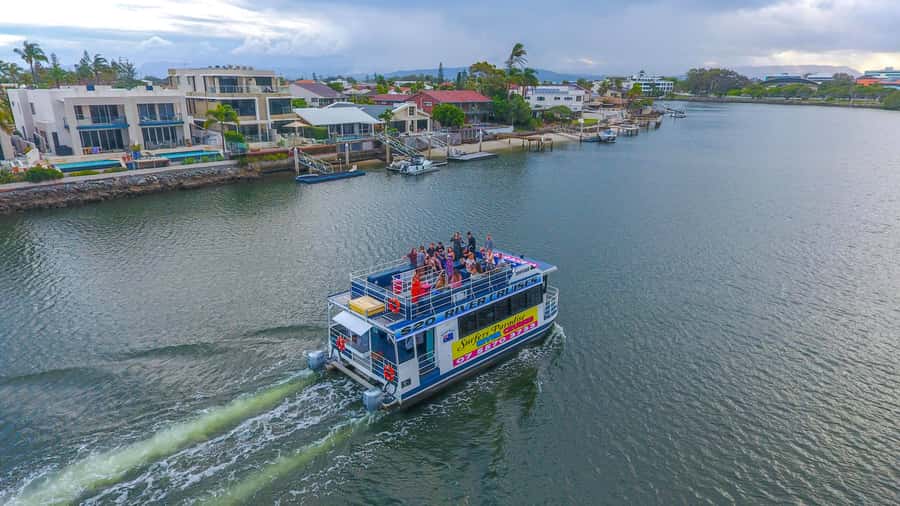 Surfers Paradise: Sightseeing Midday River and Canal Cruise - The top deck, indoor seating, and midday sun