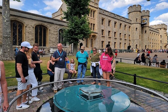 Tower of London: Guided Tour with Thames River Cruise - Inside the Tower: prisons, ravens, and royal power
