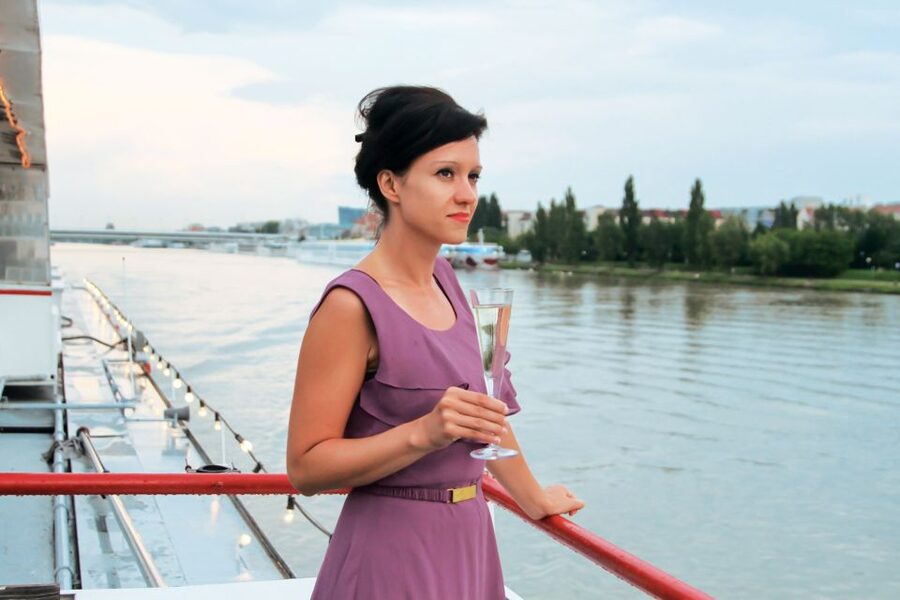 Vienna: Evening Cruise Along The Danube - The boat, seating, and onboard atmosphere